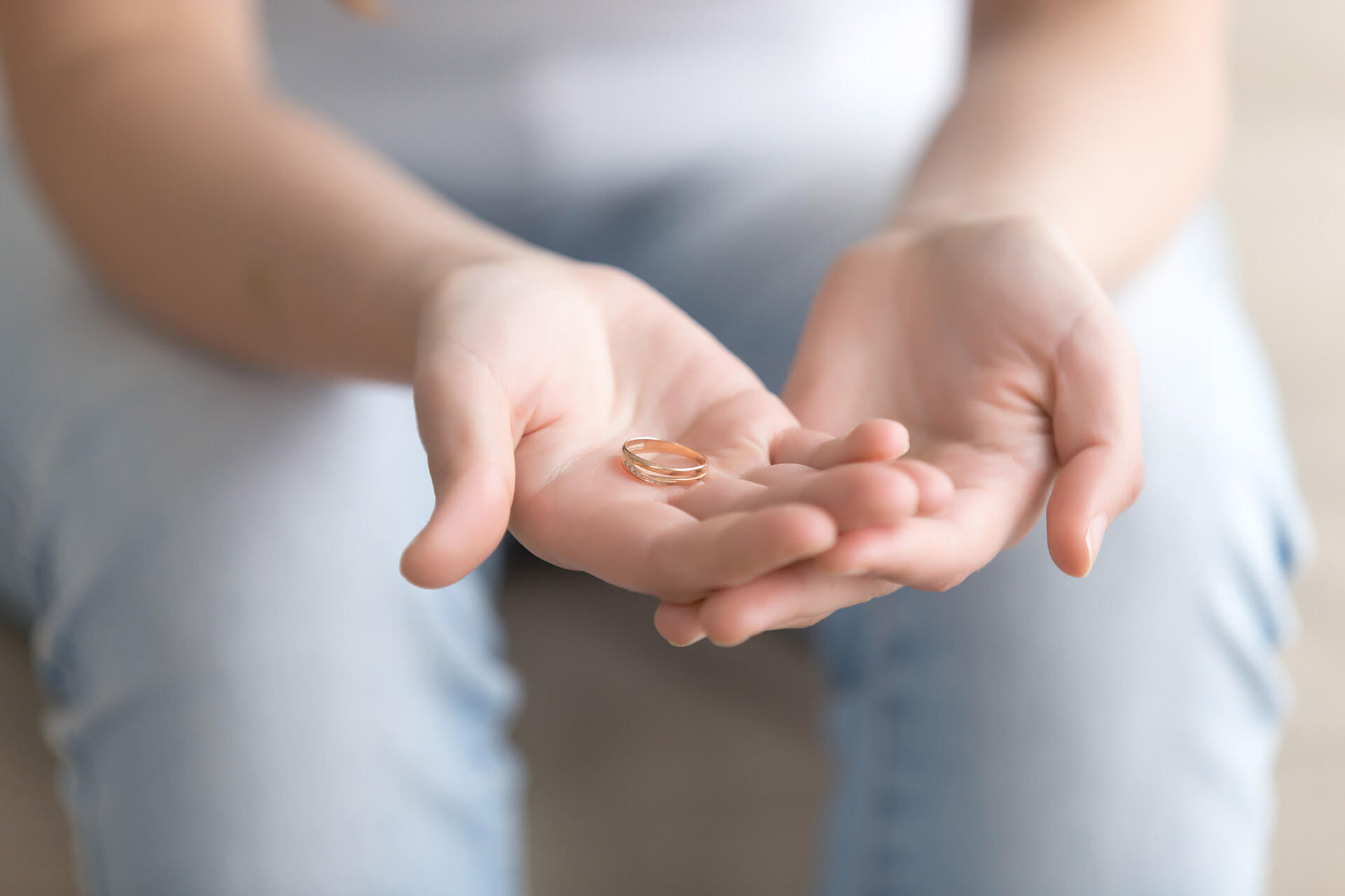 woman holding wedding ring